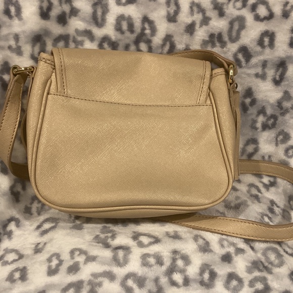 Has a tassel decoration and an adjustable strap. - Picture 3 of 3